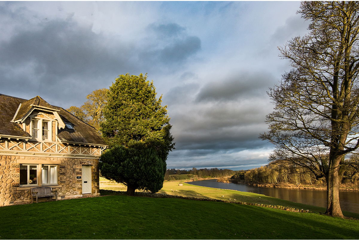 Milne-Graden-Tweedside-Holiday-Cottage-Exterior-front-door-view-of-River-Tweed