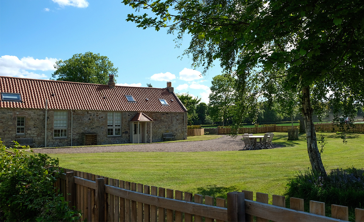 View-over-wooden-fence-to-School-House-Holiday-Cottage-Dog-Friendly-Enclosed-Garden